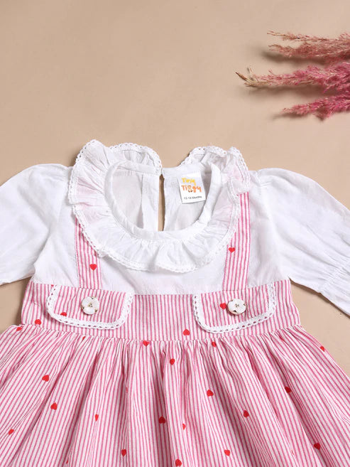 Children's dress with red polka dots