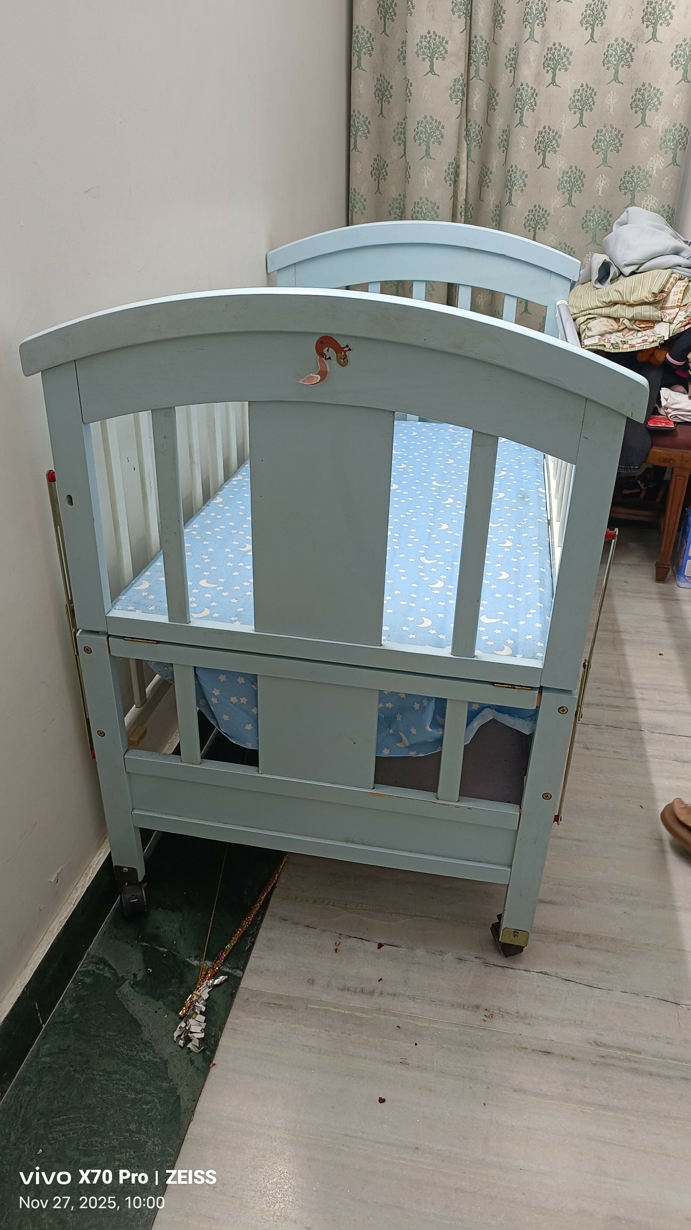Blue baby cot with mattress and side protector