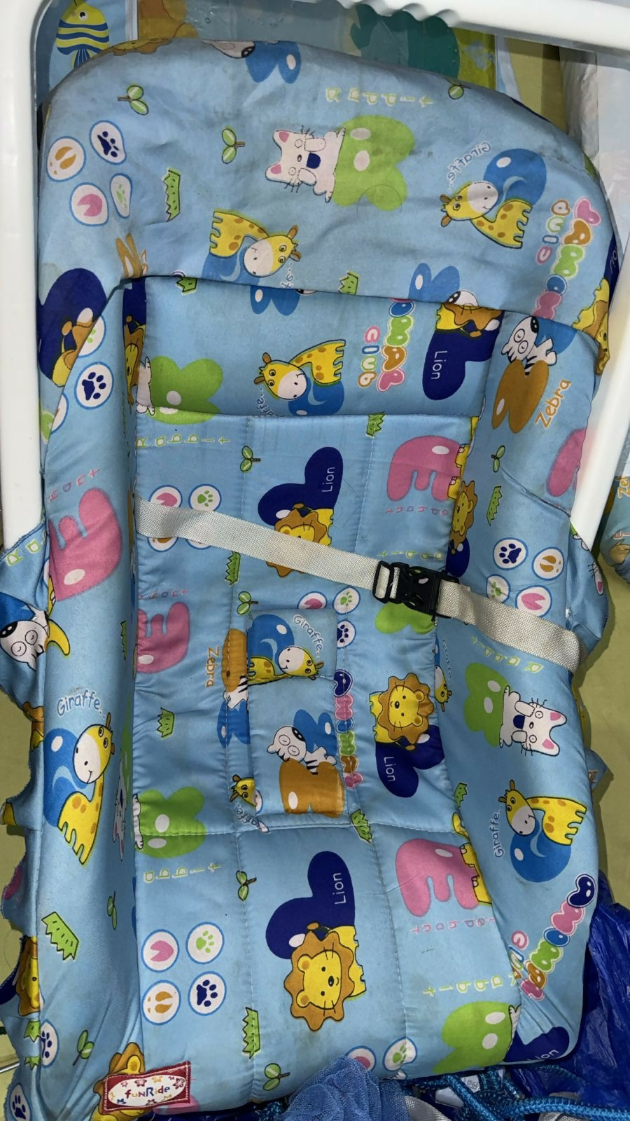 Children's seat with cartoon animal patterns on a blue background