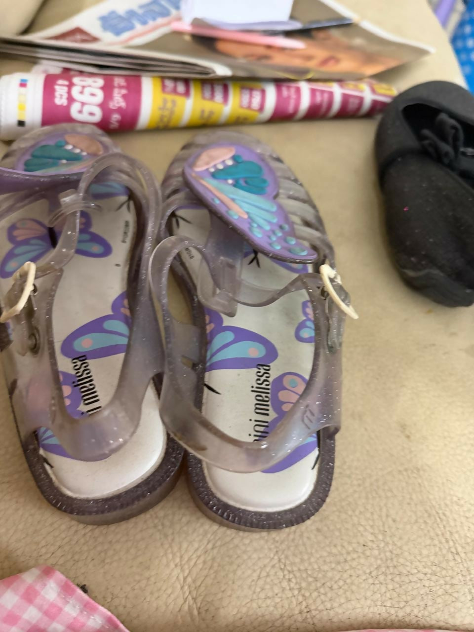 Pair of children's sandals with butterfly design