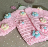 Baby sweater, headband, booties, cap, and mittens set – a cozy and stylish outfit to keep your little one warm and comfortable.