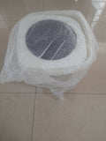 Round gray object wrapped in bubble wrap on a tiled floor