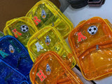 Colorful transparent bags with various designs on a white surface