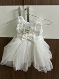 White children's dress with a bow