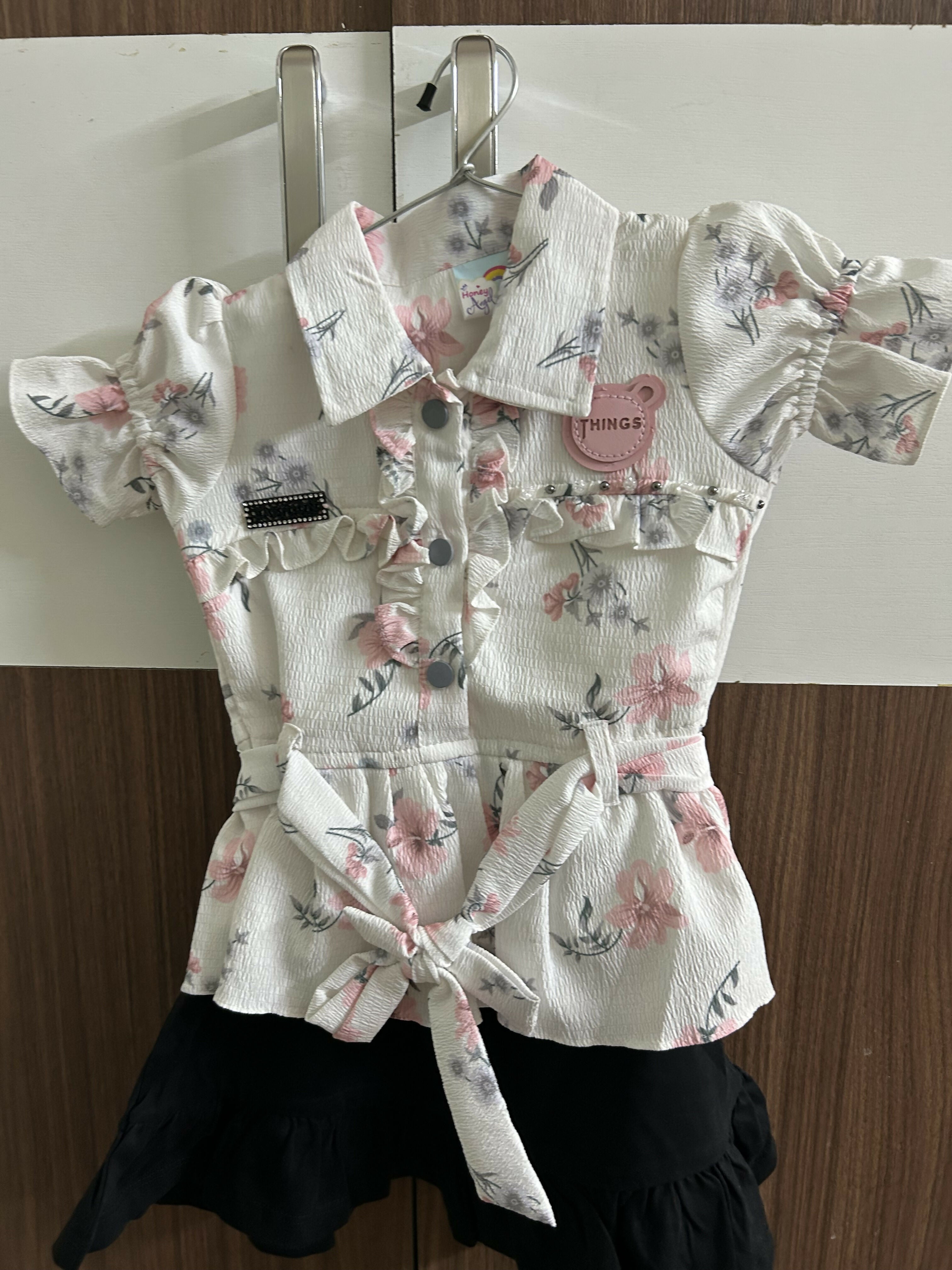 Floral dress with ruffled sleeves and collar