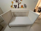 IKEA Sundvik white baby cot with mattress, fitted sheets and cot bumpers, almost new condition, convertible toddler bed design