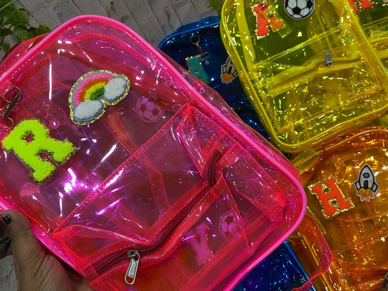 Clear plastic bags with colorful letter decorations in various colors.