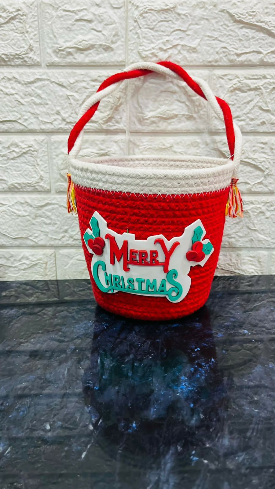 Red woven basket with 'Merry Christmas'