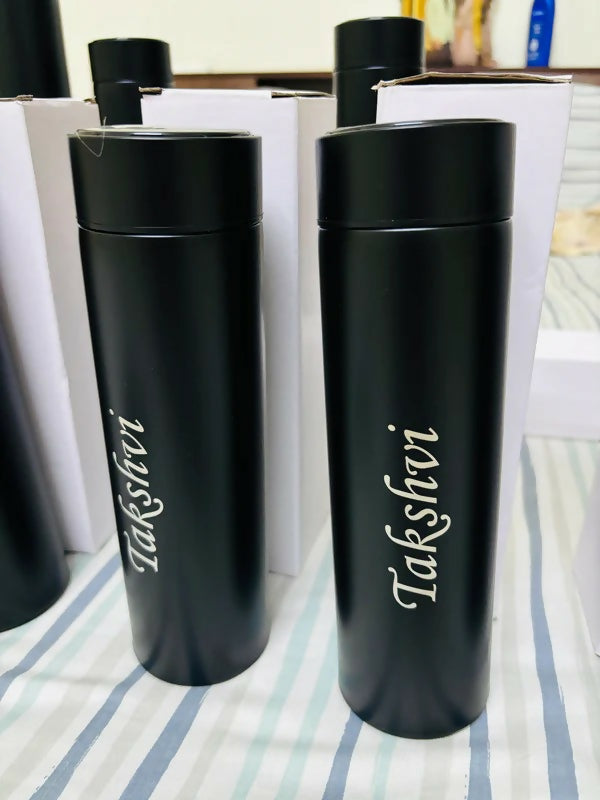 Two black thermos bottles with 'Taksfevi' branding