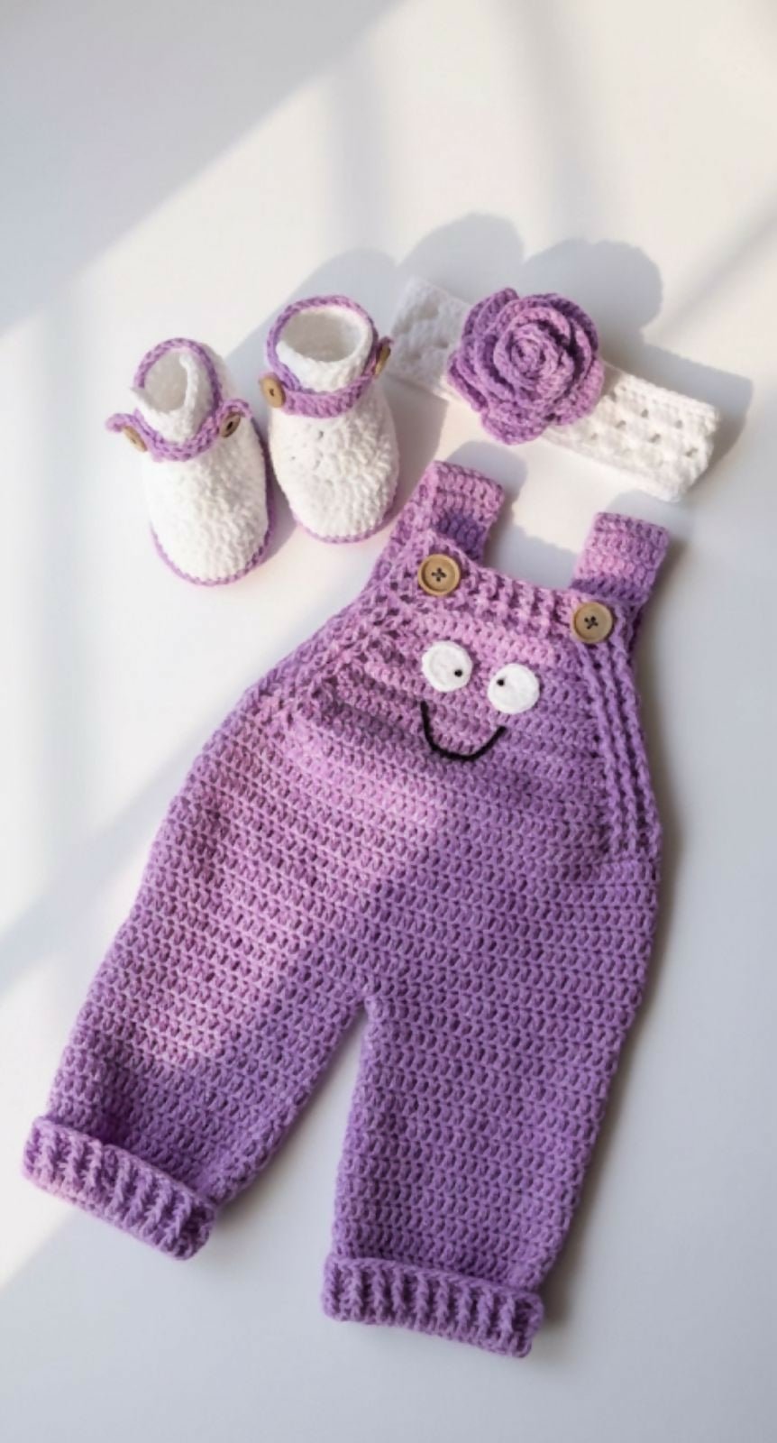 Purple crochet baby outfit with overalls, booties, and headband