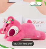 Pink plush toy with a flower on its headband