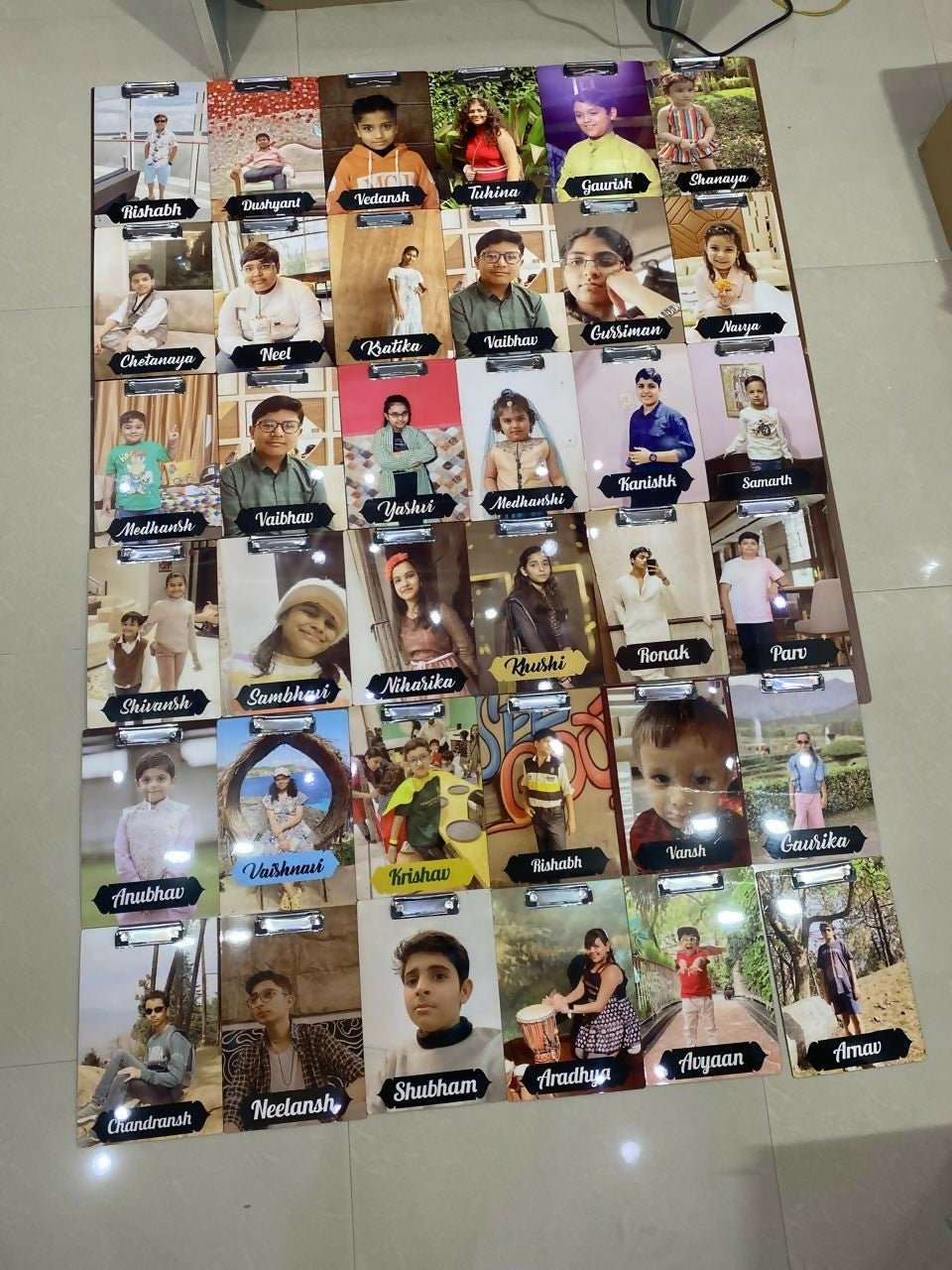 Poster with multiple small images of people with names below each