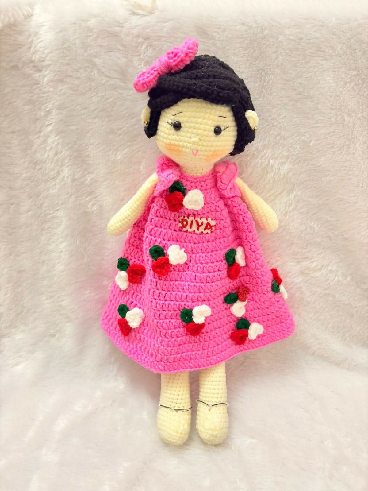 Personalised baby doll with soft hair and custom name embroidery – perfect gift for infants and toddlers.