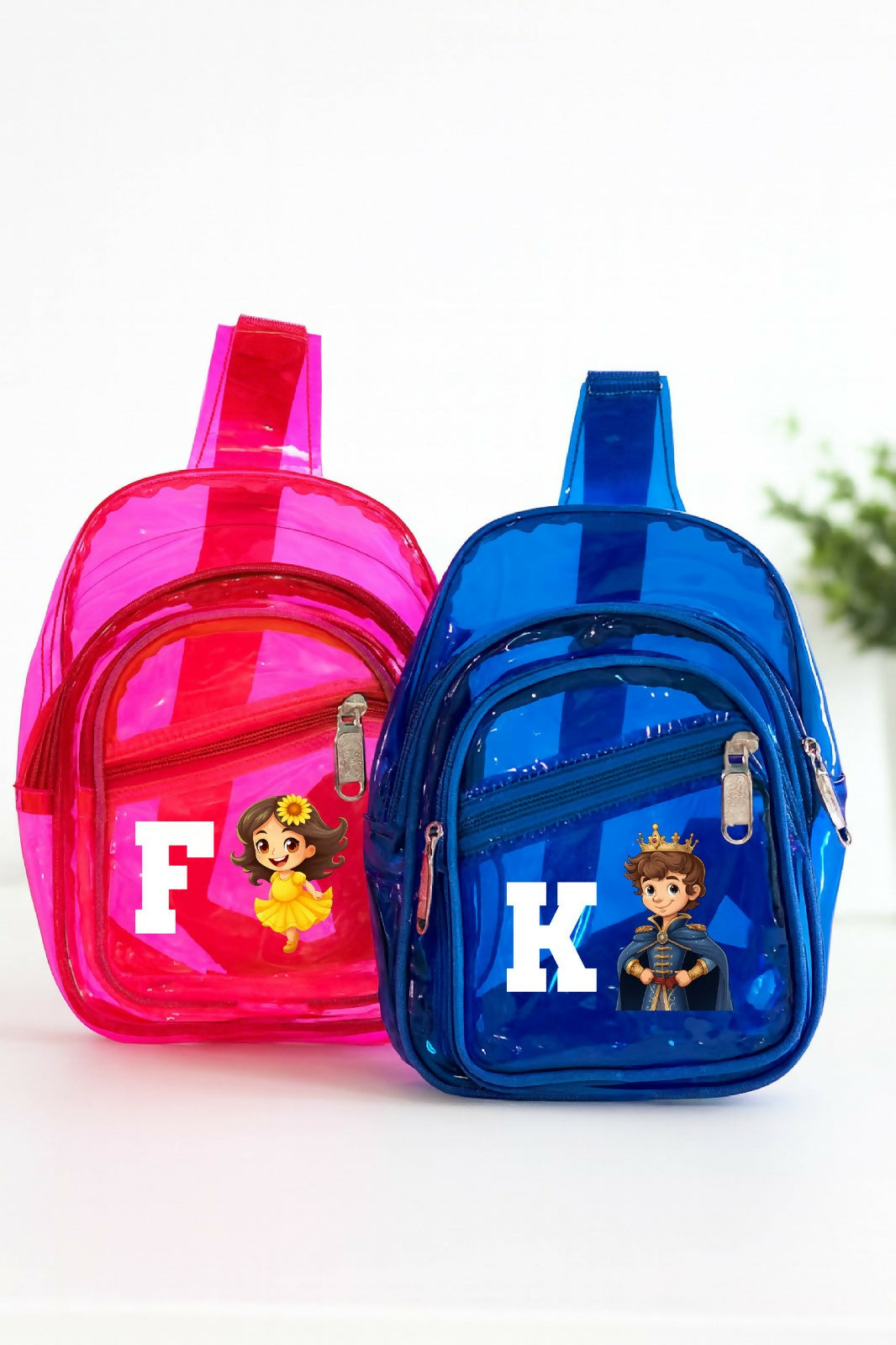 Pink and blue transparent mini backpacks with cartoon characters and letters on a white background