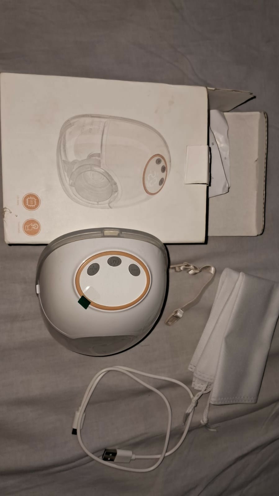 AENTIK YW-788 electric wearable breast pump with hands-free design, compact milk collection cups, adjustable suction settings, and portable pumping support for breastfeeding mothers.