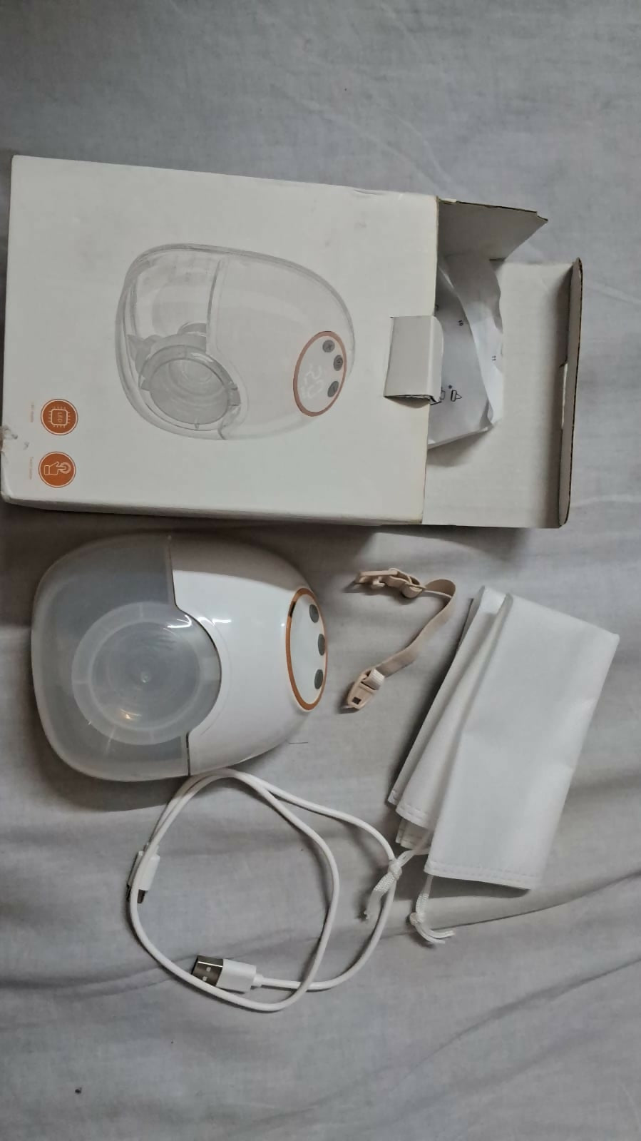 AENTIK YW-788 electric wearable breast pump with hands-free design, compact milk collection cups, adjustable suction settings, and portable pumping support for breastfeeding mothers.