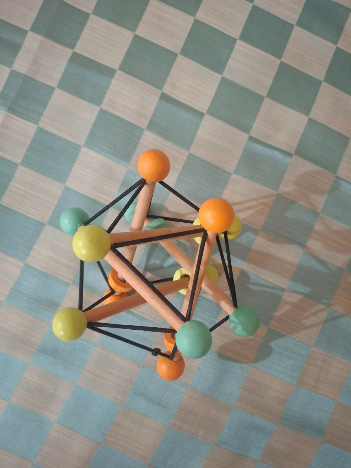 Curious cub geometric rattle ball toy