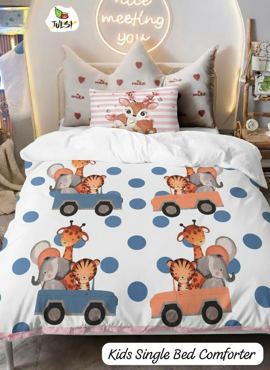 Children's bed comforter with animal designs on a bed