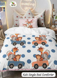 Children's bed comforter with animal designs on a bed