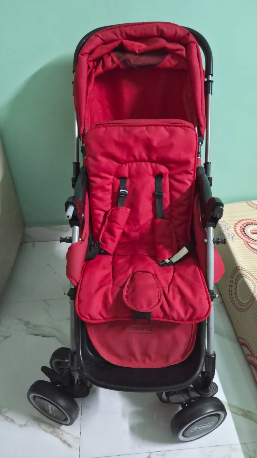 BABYHUG 2-in-1 Rock and Roll stroller with reclining seat, foldable design, adjustable canopy, 5-point safety harness, smooth wheels, and storage basket for comfortable everyday travel.