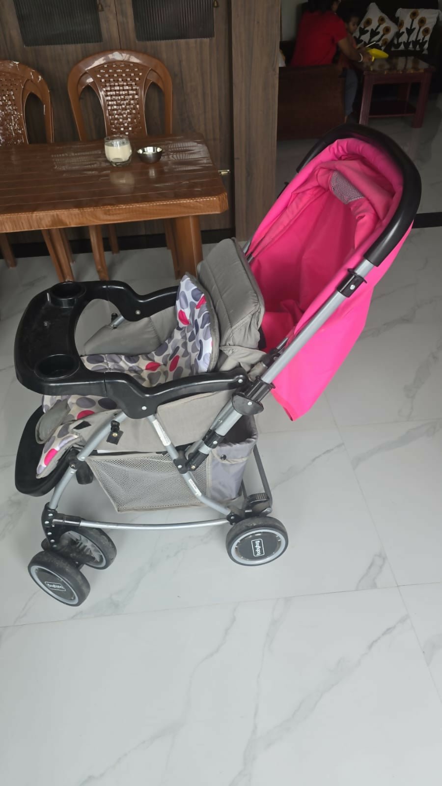 BABYHUG 2 in 1 Rock and Roll stroller cum rocker with reclining seat, sturdy wheels, safety harness, canopy, and dual stroller-to-rocker design for baby comfort and travel.