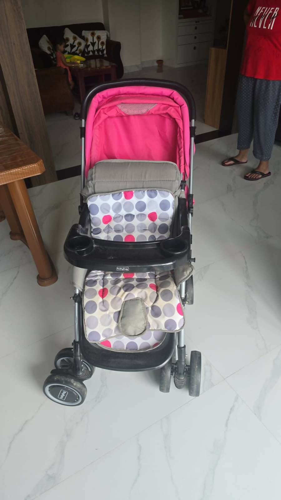 BABYHUG 2 in 1 Rock and Roll stroller cum rocker with reclining seat, sturdy wheels, safety harness, canopy, and dual stroller-to-rocker design for baby comfort and travel.