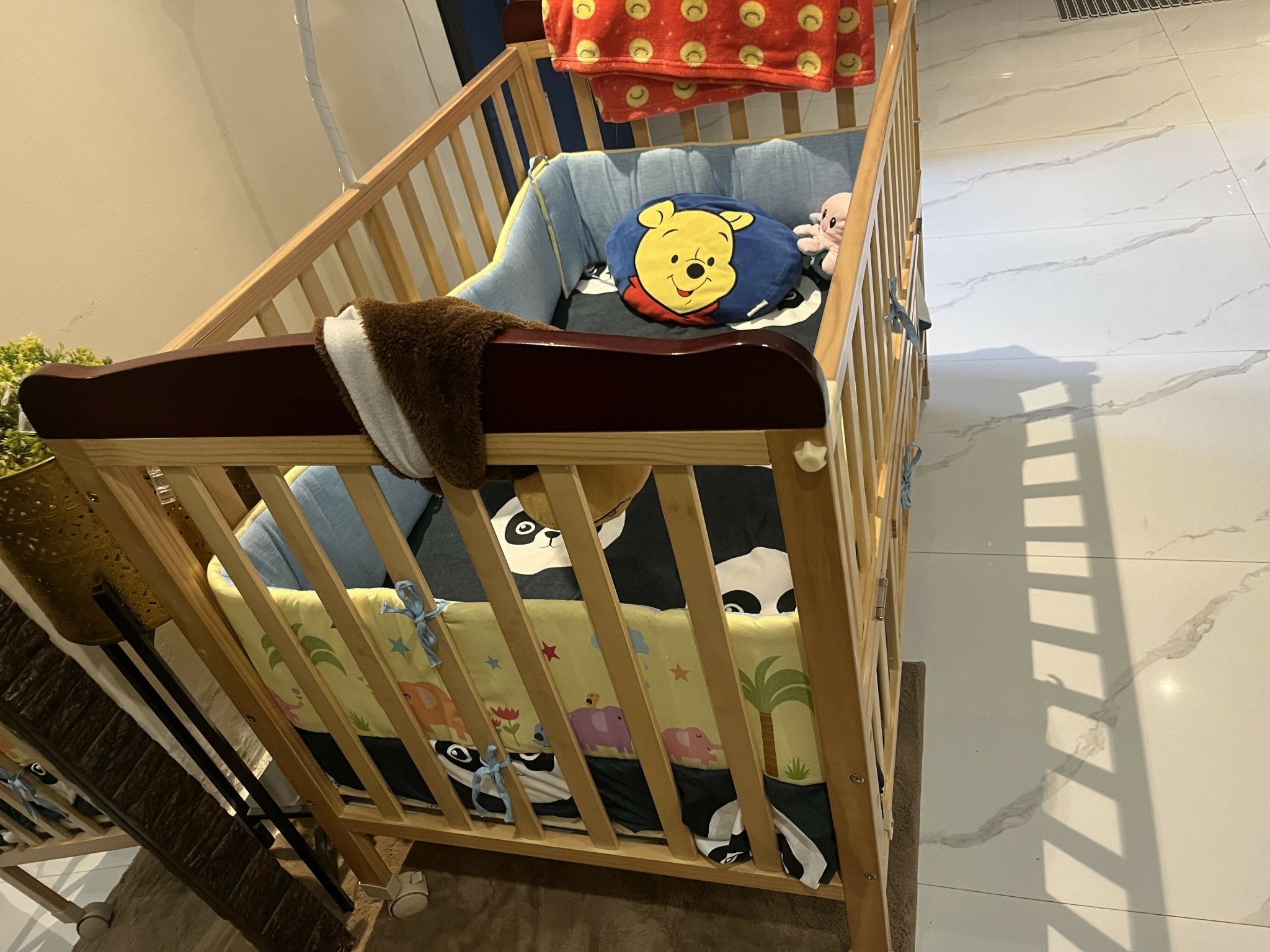 BABYHUG Hamilton baby cot with sturdy construction, spacious sleeping area, secure side rails, and comfortable support for newborns, infants, and growing babies.
