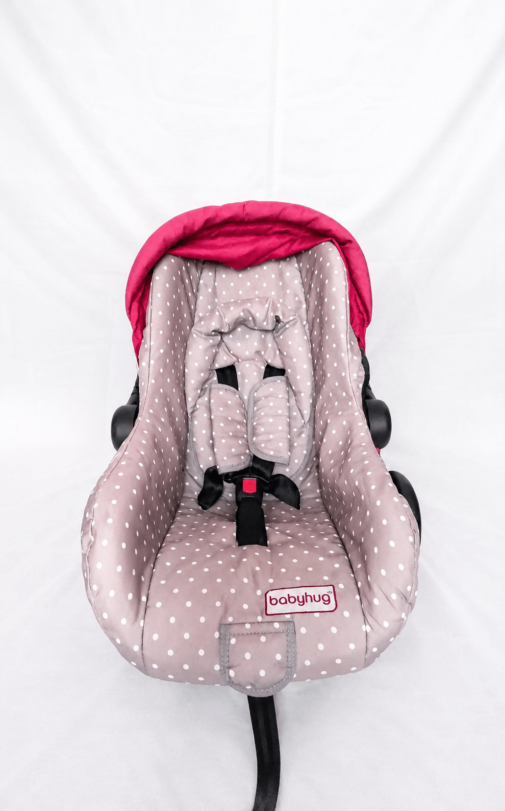 BABYHUG infant car seat carry cot with baby carrier function, rear-facing design, cushioned seat, secure safety harness, and carry handle for newborns and infants up to 13 kg.