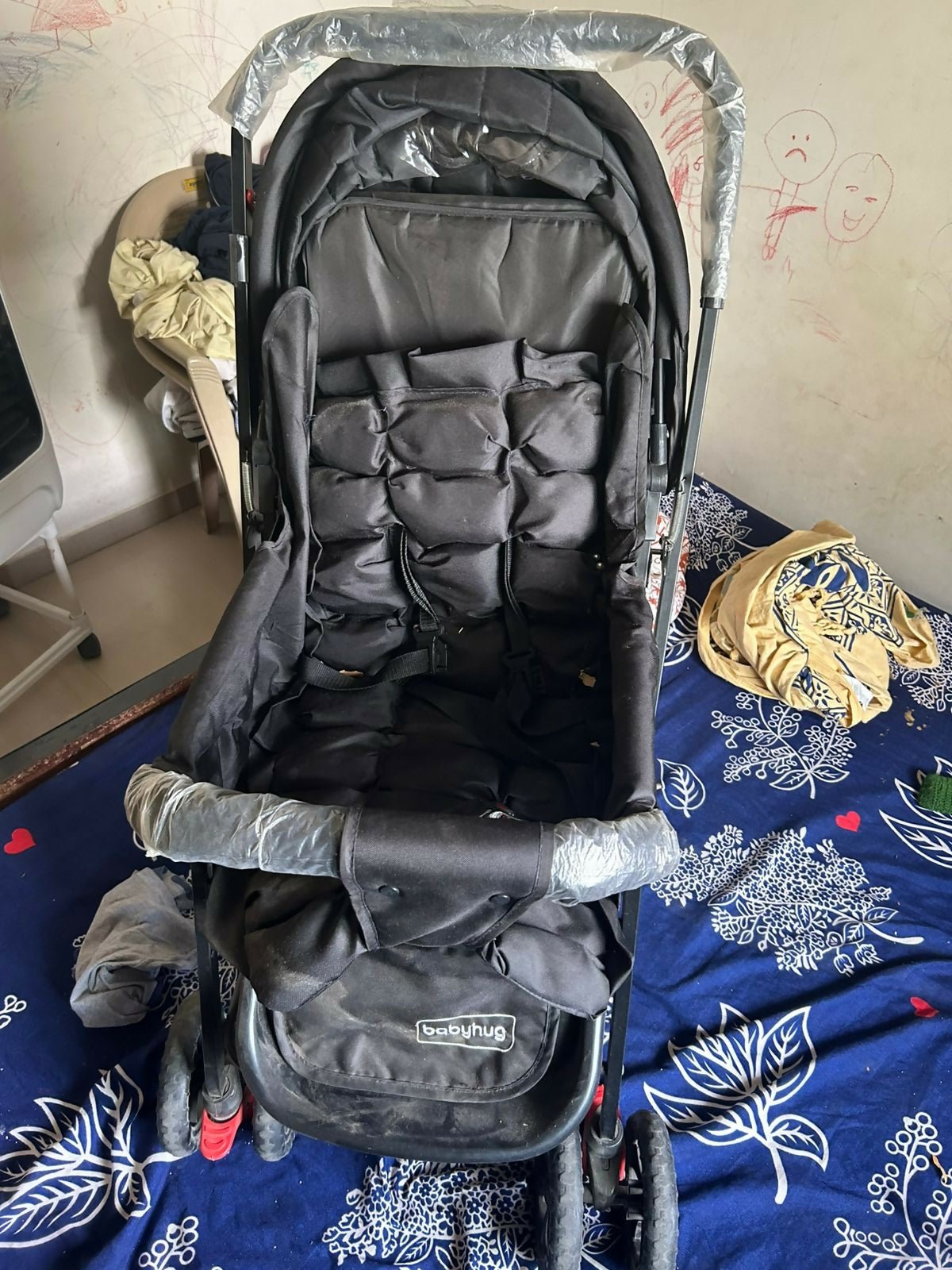 BABYHUG Cocoon stroller with mosquito net, reclining seat, safety harness, protective canopy, smooth wheels, and comfortable travel design for babies.
