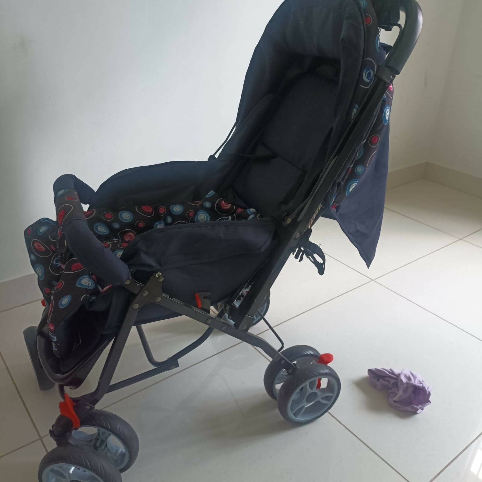 BABYHUG Comfy Ride stroller in dark blue with reclining seat, foldable design, safety harness, adjustable canopy, smooth wheels, and comfortable travel support for babies and toddlers.