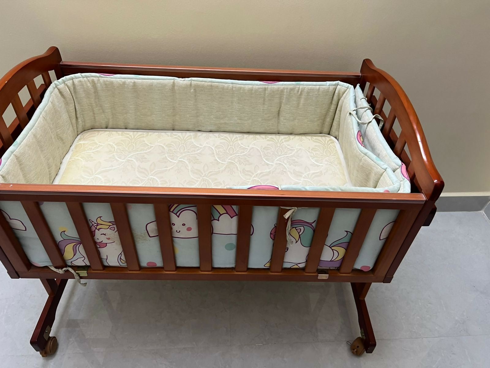 BABYHUG cradle with BABYHUG mattress and bumpers featuring cozy sleeping space, cushioned mattress, protective side bumpers, sturdy frame, and comfortable support for baby sleep.