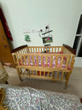 BABYHUG Hamilton wooden cot/crib with sturdy wooden construction, spacious storage drawer, comfortable mattress, protective side rails, and a durable design for newborns and growing babies.