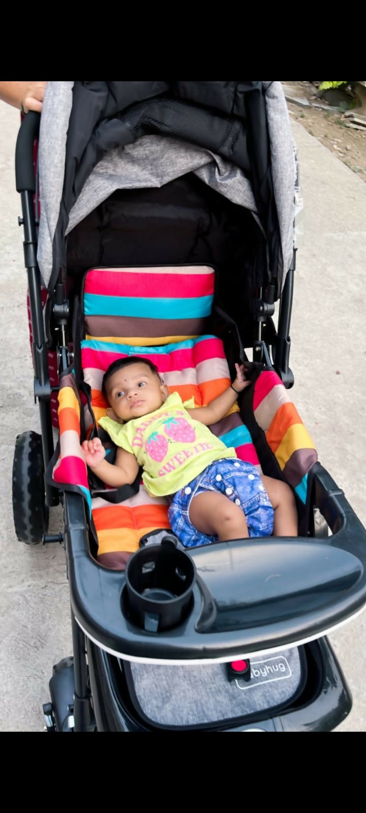 BABYHUG Melody stroller with reversible handle and canopy, reclining seat, smooth wheels, safety harness, and comfortable travel design for babies and toddlers.