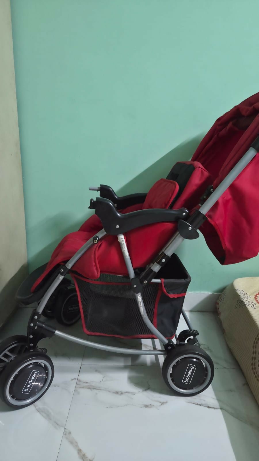 BABYHUG 2-in-1 Rock and Roll stroller with reclining seat, foldable design, adjustable canopy, 5-point safety harness, smooth wheels, and storage basket for comfortable everyday travel.