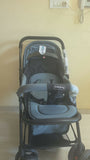 BABYHUG Symphony stroller with reversible handle, reclining seat, safety harness, adjustable canopy, smooth wheels, and comfortable travel support for babies and toddlers.