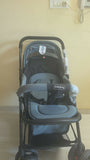 BABYHUG Symphony stroller with reversible handle, reclining seat, safety harness, adjustable canopy, smooth wheels, and comfortable travel support for babies and toddlers.