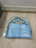Baby bed with hanging toys featuring a soft cushioned asleeping area, protective sides, and colorful hanging toys to keep babies comfortable, engaged, and entertained.