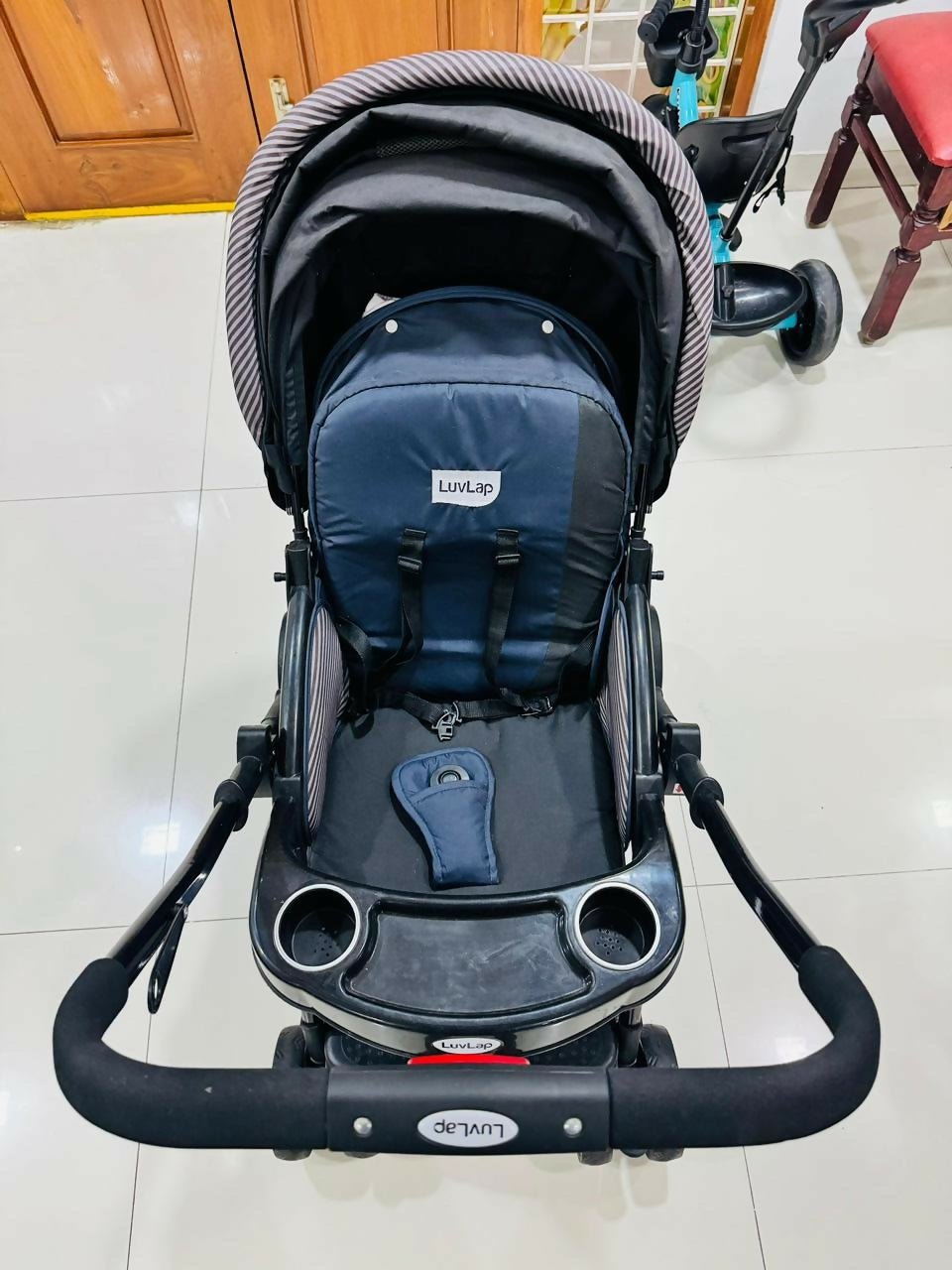 LuvLap baby stroller with lightweight foldable design, reclining seat, adjustable canopy, 5-point safety harness, smooth wheels, and storage basket for comfortable travel with babies and toddlers.