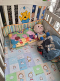 Wooden baby crib with storage, mattress, and bumper featuring sturdy wooden construction, spacious sleeping area, built-in storage, protective bumpers, and comfortable support for babies.