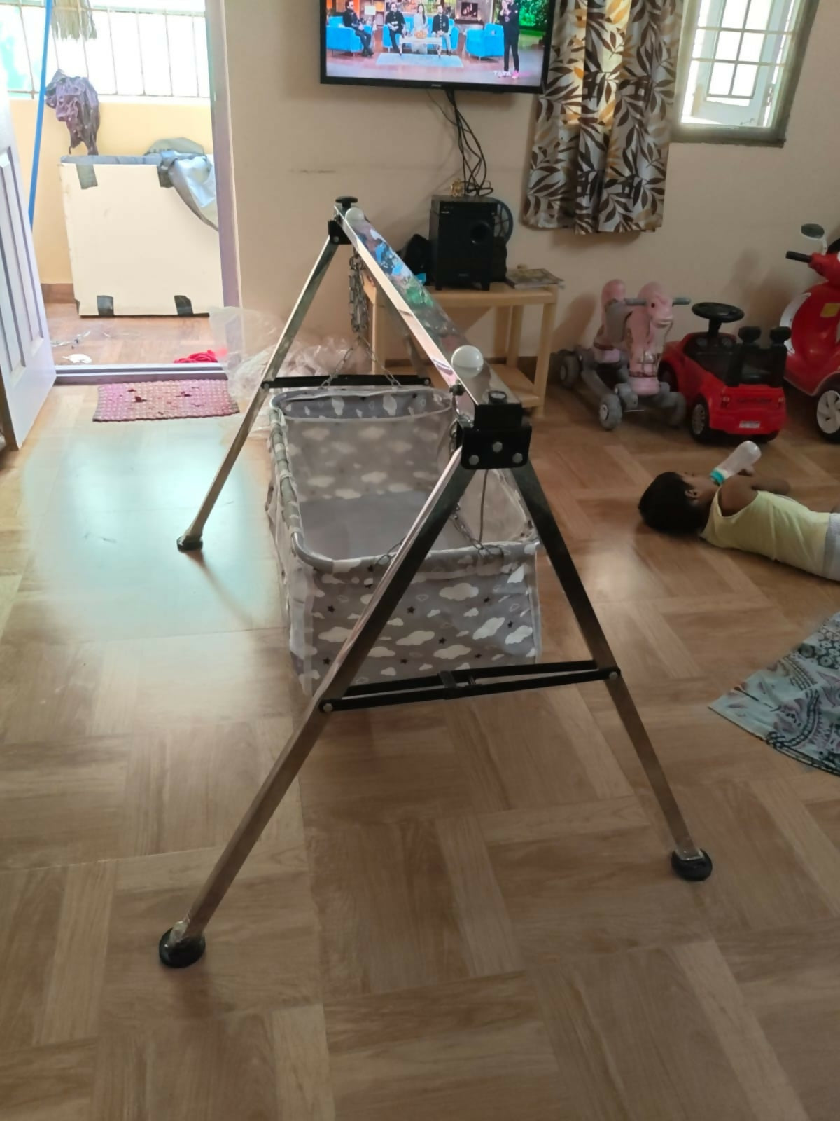 Steel Cradle for Baby featuring a sturdy metal frame, comfortable sleeping space, gentle rocking design, and durable construction for soothing and resting newborns and infants.