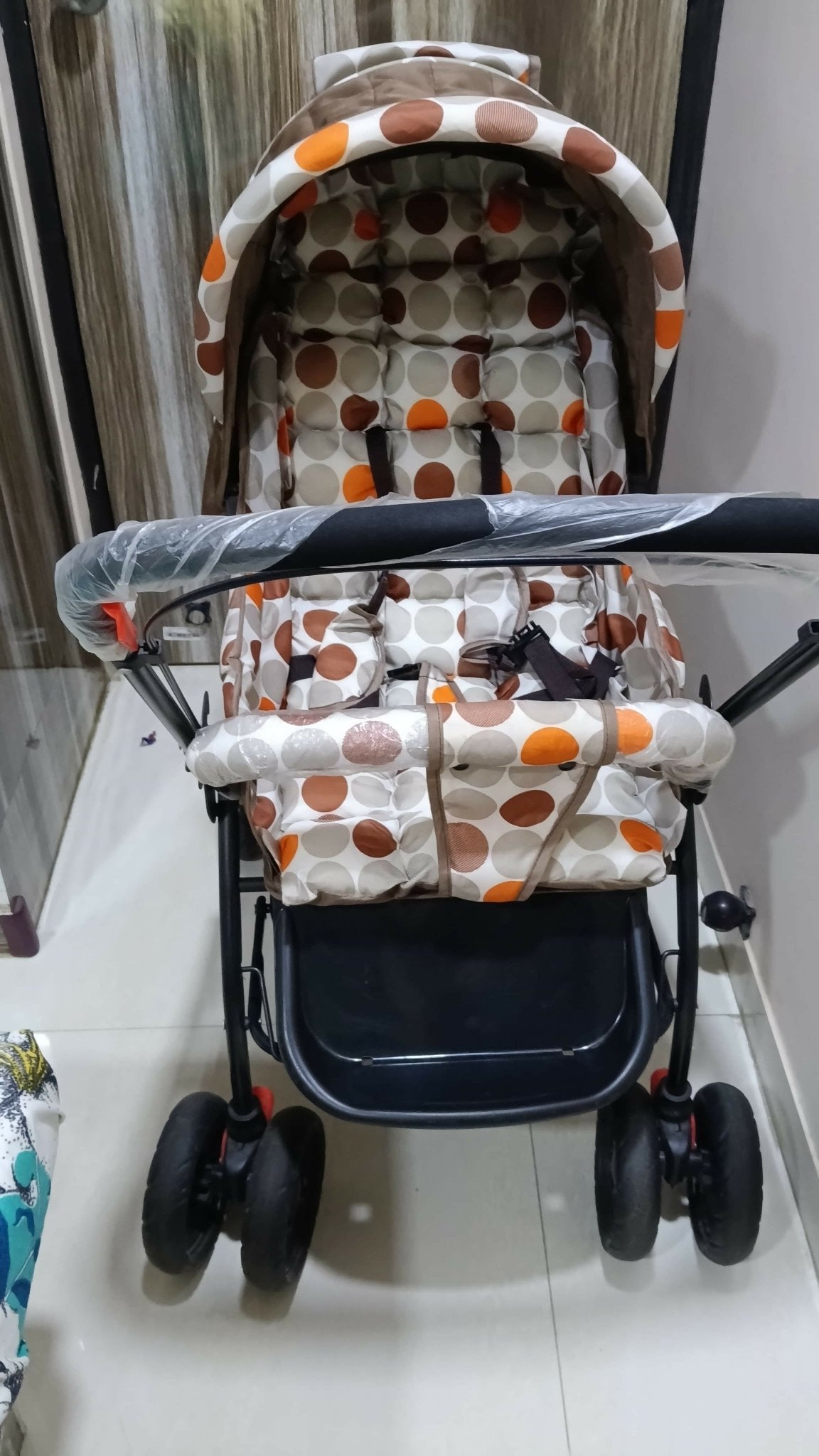 BABYHUG stroller with a lightweight foldable design, reclining seat, adjustable canopy, 5-point safety harness, smooth wheels, and spacious storage basket for comfortable travel with babies and toddlers.