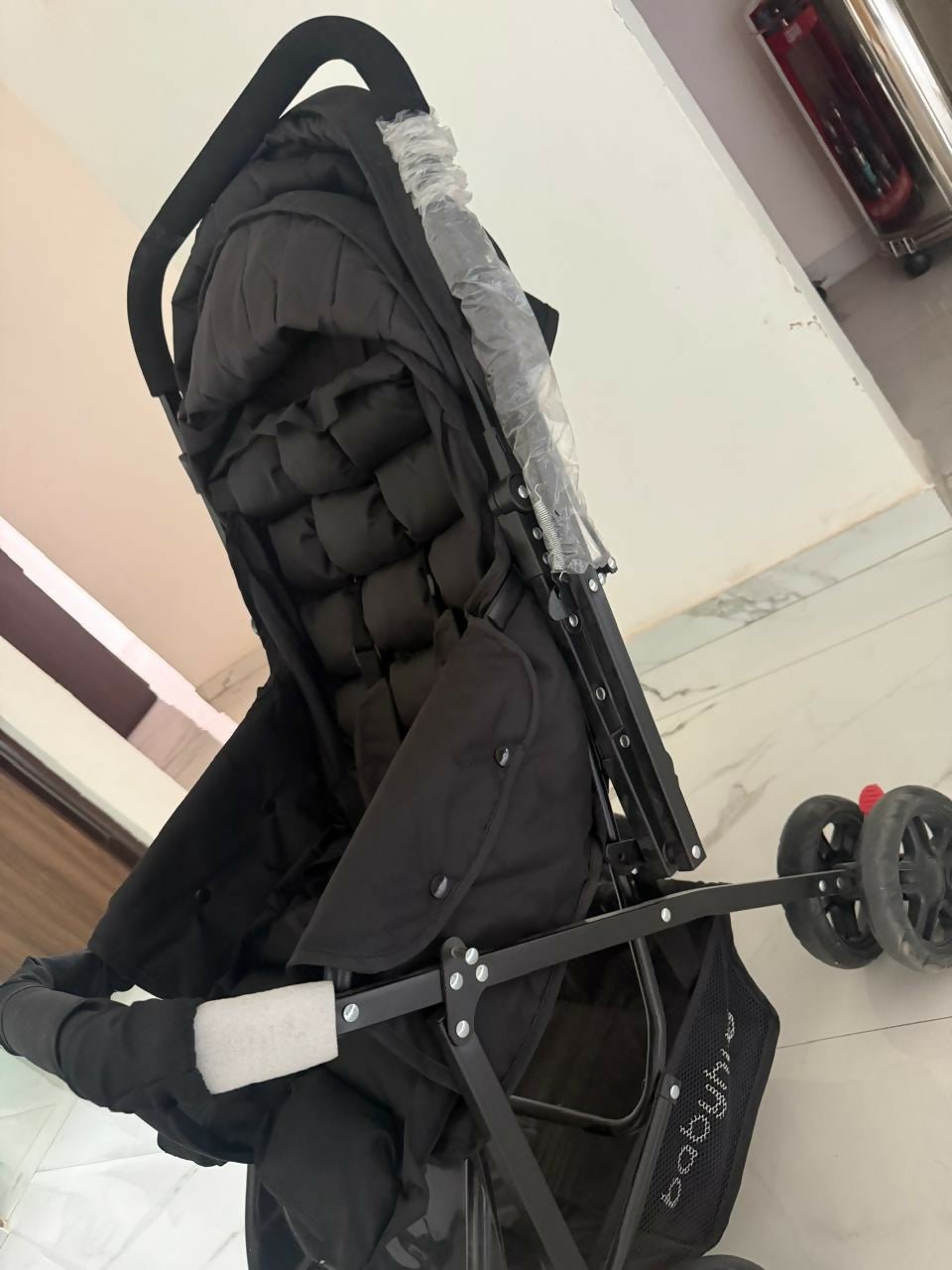 BABYHUG Cocoon stroller/pram with a reclining seat, foldable dacesign, adjustable canopy, 5-point safety harness, smooth wheels, and storage basket for comfortable travel with babies and toddlers.