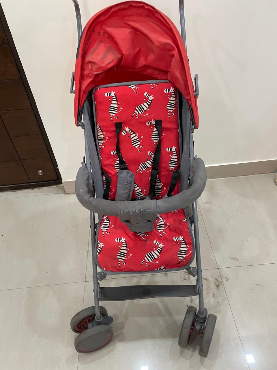 POLKA TOTS baby stroller with 5-point safety harness, adjustable canopy, storage basket, lightweight umbrella-fold design, and smooth wheels for babies and toddlers up to 20 kg (0–5 years).