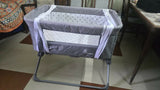 R for Rabbit Hop A Little baby cot bedside bassinet with sturdy frame, breathable sides, adjustable height, and a cozy sleeping space for newborns and infants.
