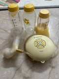 MEDELA Swing electric breast pump with bottles – compact, efficient, and easy for mothers on the go.