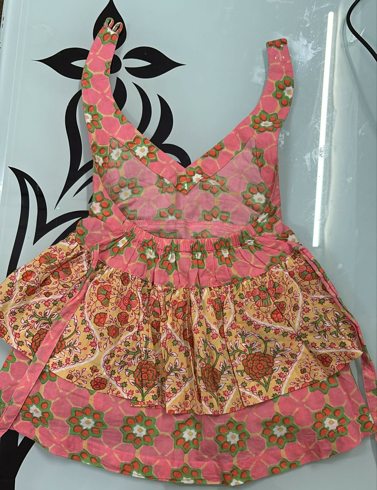 Floral patterned dress on a light blue background