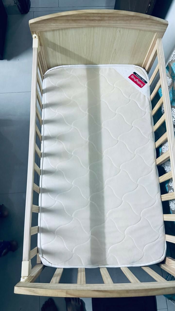 BABYHUG 4 in 1 convertible baby cot with rocking function, cozy sleeping space, sturdy frame, adjustable design, and rocking feature for baby comfort and safe sleep.
