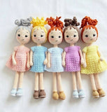 Handcrafted crochet baby doll soft toy with curly hair, soft yarn construction, detailed stitching, and a cuddly design for babies, kids, gifting, and nursery décor.