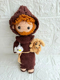 Handmade St. Francis of Assisi crochet doll crafted from soft yarn with detailed stitching, a gentle expression, and a charming design for gifting, collecting, or nursery décor.