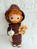 Handmade St. Francis of Assisi crochet doll crafted from soft yarn with detailed stitching, a gentle expression, and a charming design for gifting, collecting, or nursery décor.